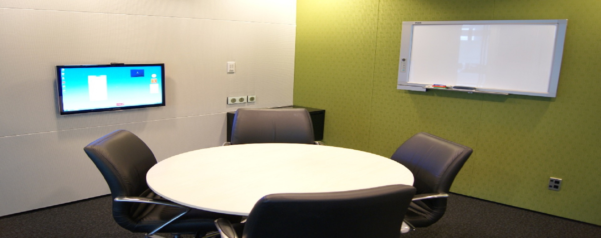 BECA meeting room with interactive whiteboard and display screen
