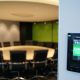 Available sign on black Wall mounted Crestron boardroom booking system