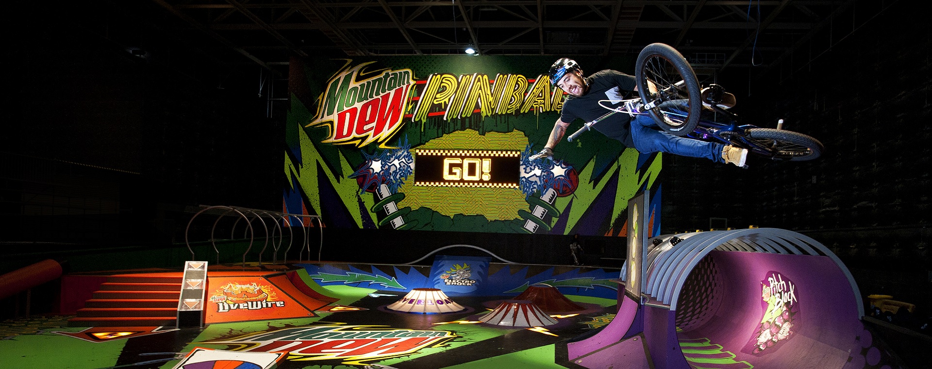 Haimoana Ngata gets air on a BMX at the Mountain Dew Skate Park giant pinball machine in Auckland