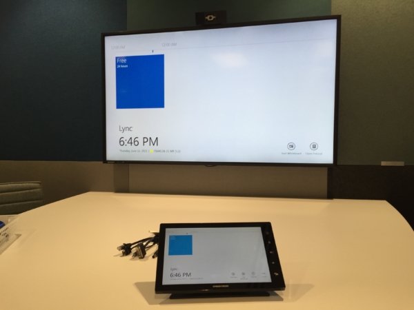 Wall mounted TV with Crestron touch pad controller at Fonterra Experience Centre