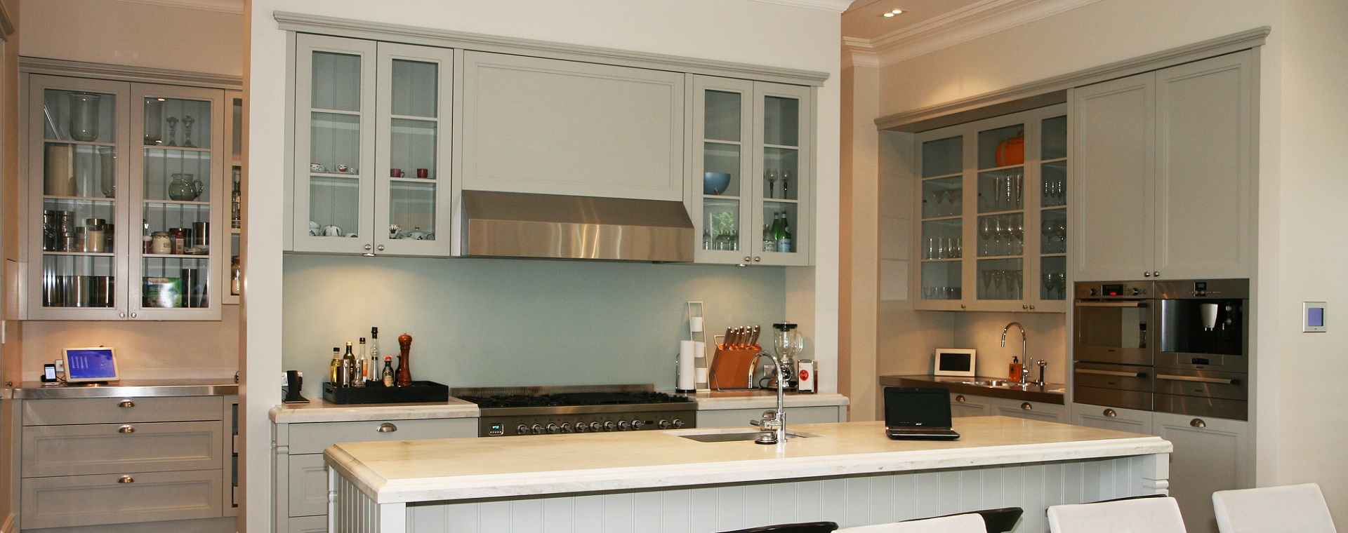 Modern kitchen with mobile touchscreens and in-wall touchscreen to control home automation and entertainment