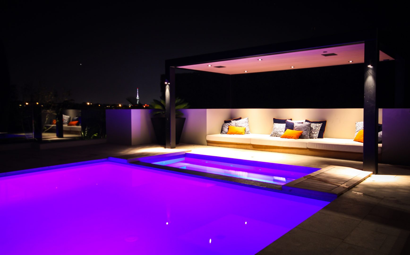 Outdoor entertaining pool area with speakers and lighting control