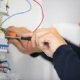 Electrician working on house electric system