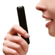Woman speaking into smart phone