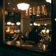 Restaurant window with 'relax' sign and warm glow lighting