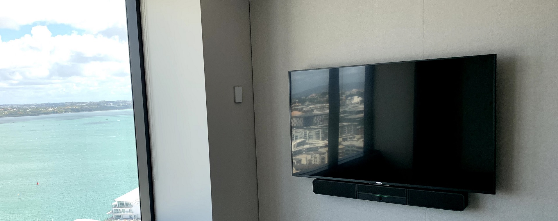 Display screen with soundbar beneath at Colliers Auckland offices