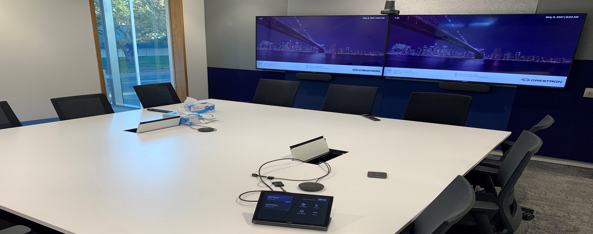 Large Fonterra meeting room with 2 large format displays and a control panel on the desk