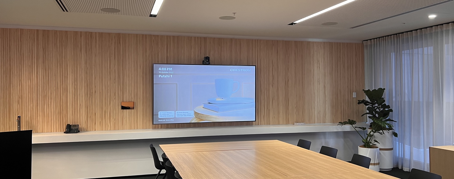Generator Bowen Campus boardroom set up with commercial display and camera for video conferencing as well as in-ceiling speakers