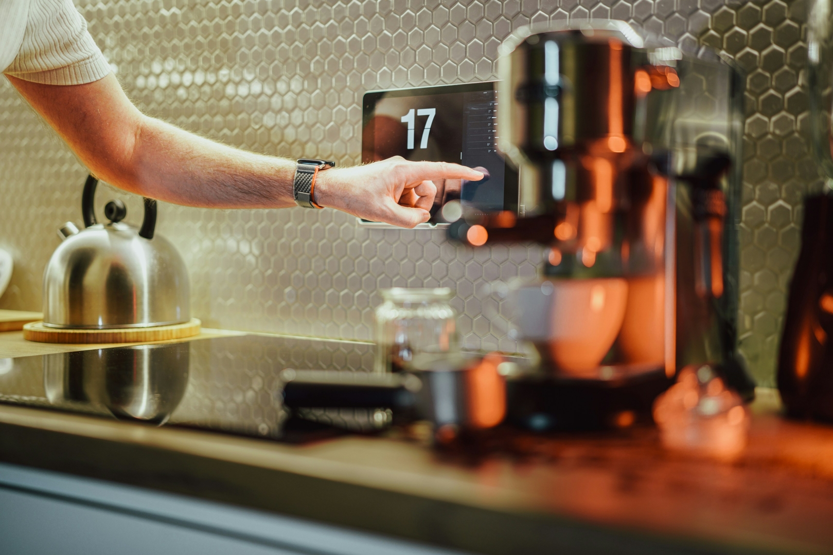 Person using touchscreen in kitchen